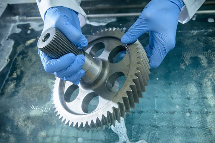 Wear gloves to remove the grease stains from the surfaces of the gear parts.